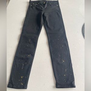 True black Skinny 7 for All Man Kind with gold splatter paint on lower legs.